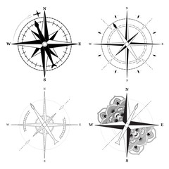 Simple signs of compasses set on white background. Vector illustration