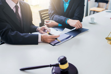 Businessman and lawyer discuss the contract document. Treaty of the law. Sign a contract business.