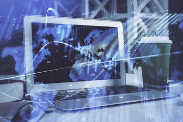 Stock market graph and table with computer background. Multi exposure. Concept of financial analysis.