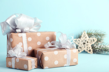 Gift boxes with ribbons and star on blue background
