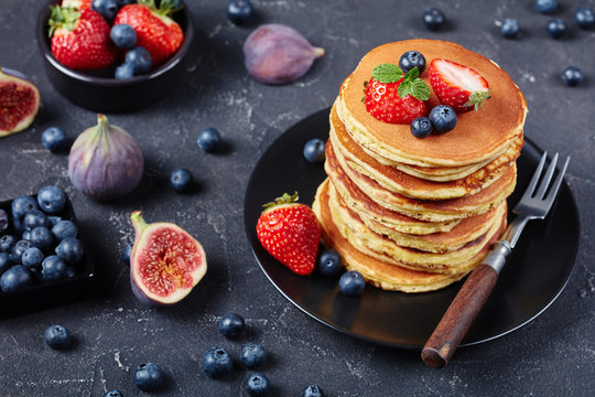 Almond Flour Pancakes On A Black Plate