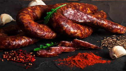 Thin uncooked smoked pork and beef sausages. Delicatessen meat.