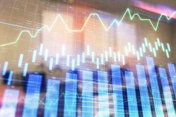 Stock market chart with trading desk bank office interior on background. Double exposure. Concept of financial analysis
