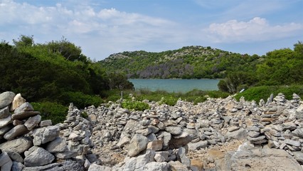 stacked rocks and lake