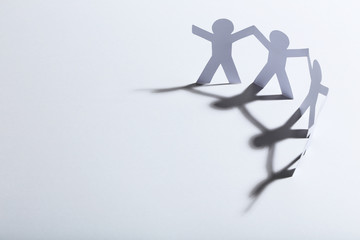 Paper chain people on white background