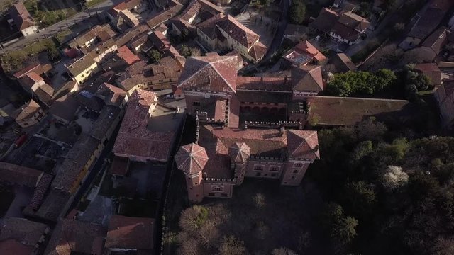 4k aerial drone backward footage over the Cereseto Castle, on the hills of Monferrato region, Alessandria province, Italy.