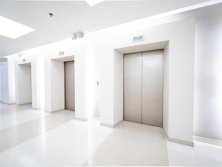 Modern steel elevator cabins in a business lobby or Hotel, Store, interior, office,perspective wide...