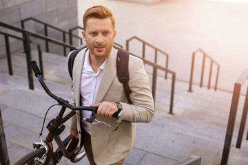 Worried man with a bicycle stock photo
