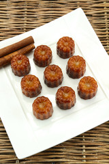 several cannelés on a plate
