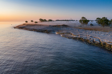 Stone wall on the Baltic sea in the summer. Osmussaar coast, island in Estonia, Europe.