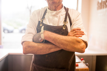 butcher serving at his butcher shop