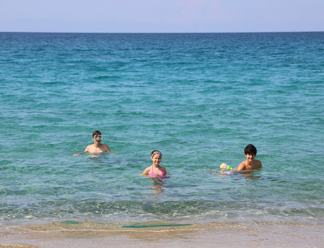three young borthers on the ocean