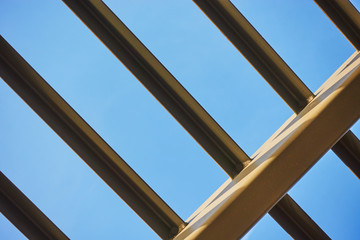 The frame is a metal canopy. Architectural element against the sky