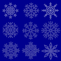 Naklejka na ściany i meble set of snowflakes on blue background, winter vector design