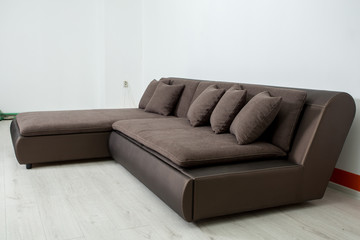 angular brown leather sofa on a white background