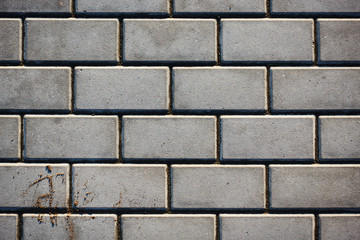 Paving slabs of rectangular brick. Texture of concrete blocks