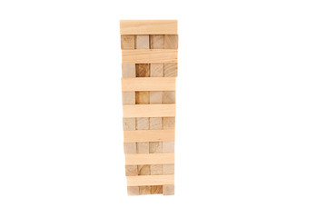 Planning, risk and strategy in business. Tower of wooden blocks isolated on a white background.