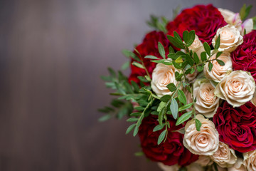 bouquet of roses on wooden table