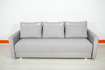 silver leather sofa on a white background