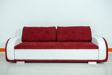 red-white sofa on a white background