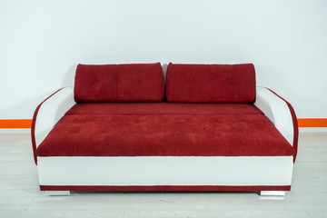 red-white sofa on a white background