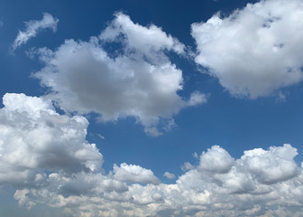 Fototapeta na wymiar View of dense, heavy, big clouds and blue sky.