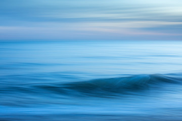 Naklejka premium Intentional camera movement creating a dreamy, blurred effect of the sea at Brighton and Hove, East Sussex.