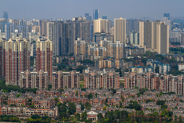 Fototapeta na wymiar Chongqing, China - March 20, 2018: Top view of the huge Chinese city of Chongqing. Sunny day in modern metropolis.