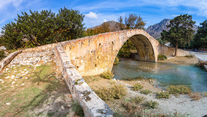 Fototapeta na wymiar Panorama of kourtaliotis river and a stone arch bridge at Preveli, Crete, Greece