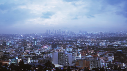 Fototapeta na wymiar Dramatic View Of Los Angeles At Night. Beautiful Sky With Clouds. Location: Los Angeles, California. Travel, cyber / futuristic, megacities concept. 