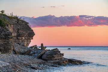 Fototapeta premium Stone wall on the Baltic sea in the summer. Pakri coast, island in Estonia, Europe.