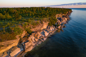 Fototapeta na wymiar Stone wall on the Baltic sea in the summer. Pakri coast, island in Estonia, Europe.