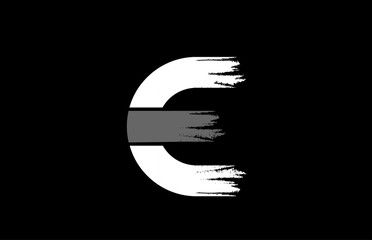 black background black and white letter E grunge alphabet logo design icon for company
