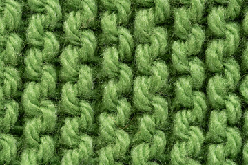 Green macro yarn close up knitted texture