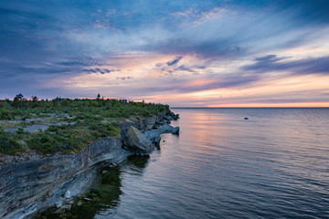 Fototapeta na wymiar Stone wall on the Baltic sea in the summer. Pakri coast, island in Estonia, Europe.