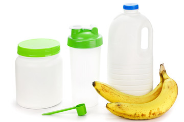 Fototapeta na wymiar Protein shaker, big bottle of milk and bananas
