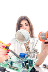 Woman Electronic Technician Repair Electronic Equipment using Electric Soldering Iron