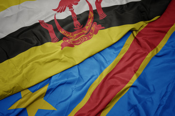 waving colorful flag of democratic republic of the congo and national flag of brunei.