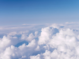 Naklejka na ściany i meble Beautiful clouds from airplane window.