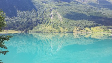 Mountain reflection from lake in Olden, Norway by K.Kis