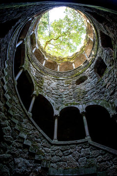 A sunken town with a spiral staircase