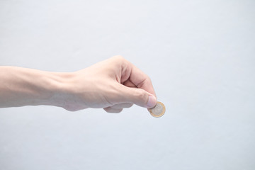 hand with coin euro coins are being filed with the hand of women change coin gold finance on the...