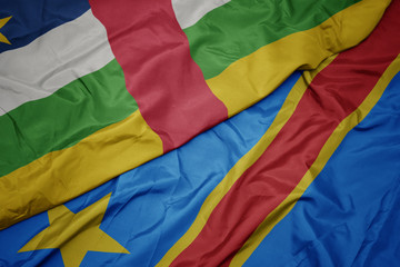 waving colorful flag of democratic republic of the congo and national flag of central african republic.