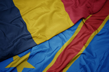 waving colorful flag of democratic republic of the congo and national flag of chad.