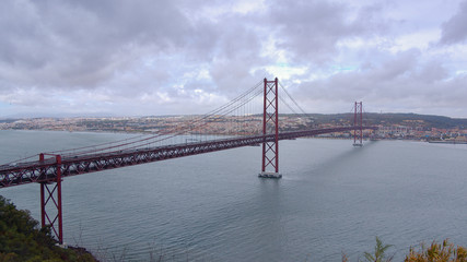 Famous 25th April Bridge over Tagus River n Lisbon - travel photography