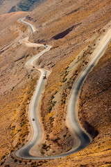 Winding road with trucks between mountains in Jujuy, Argentina