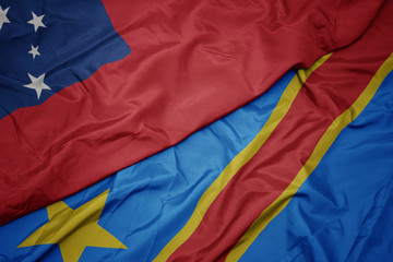 waving colorful flag of democratic republic of the congo and national flag of Samoa .