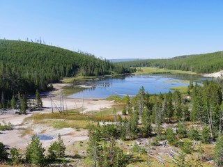 Wide shot of Nymph Lake along the road north of Norris Geyser Basin in Yellowstone National Park.