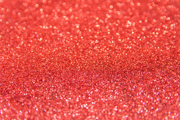 Defocused red glitter background. Gold abstract bokeh background. Christmas abstract background