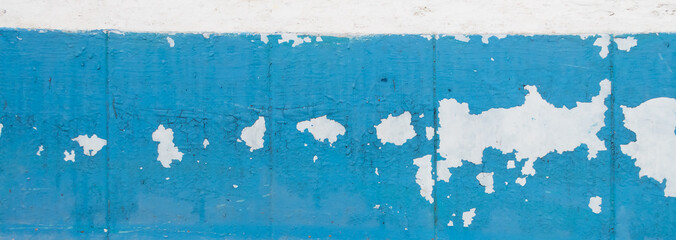 Texture of old peeling paint, vintage graffiti background, it's time to make repairs, cracked paint texture.  Clipart, white, blue old paint, panoramic photo
